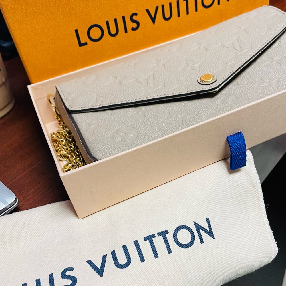 Louis Vuitton beige imprinted crossbody bag with gold chain